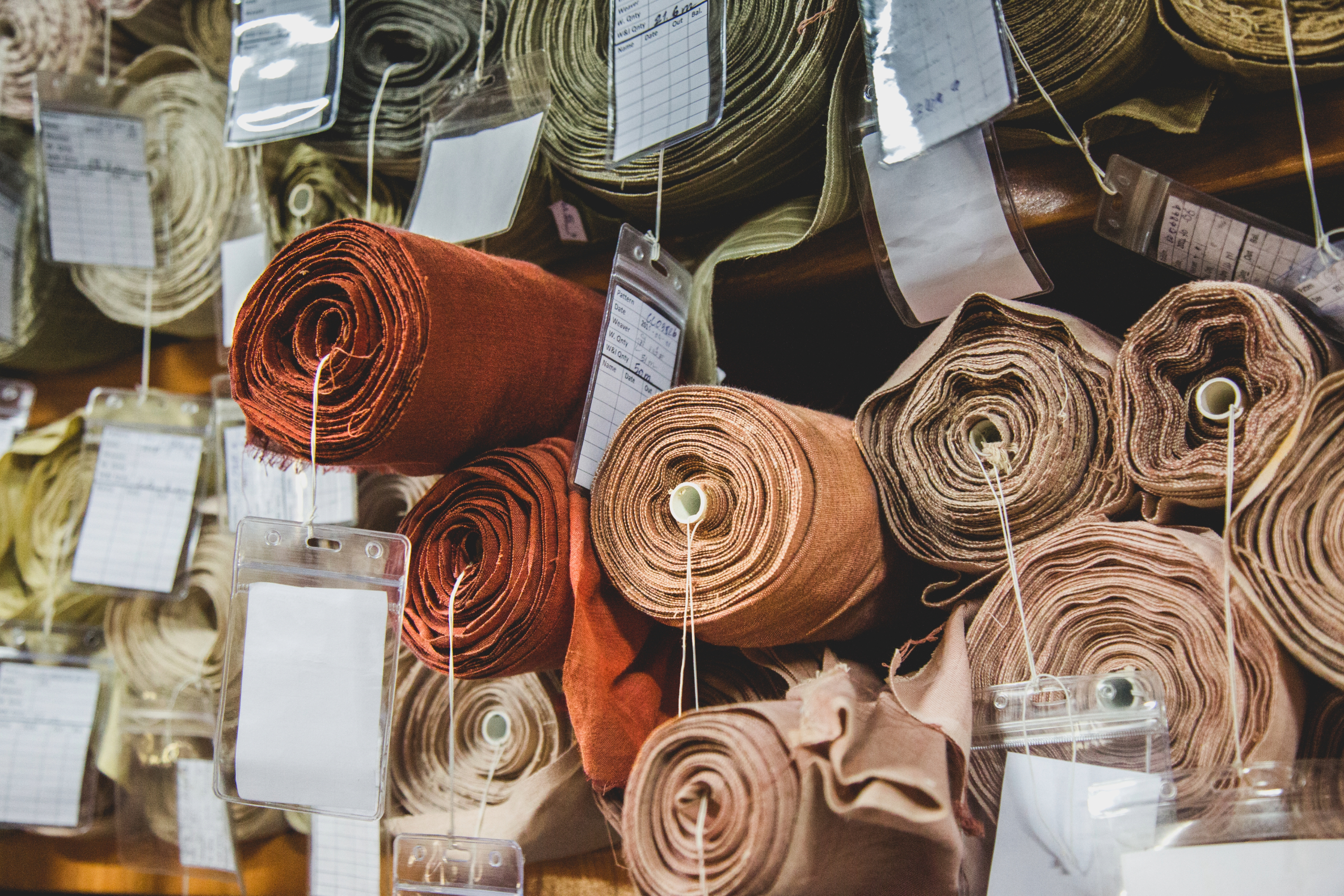 stacked textiles with labels on them